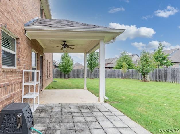 1531 Wingate Park Ct, Montgomery, AL 36117 - fenced backyard featuring a ceiling fan and a patio area