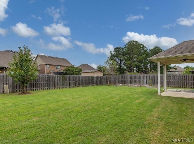 1531 Wingate Park Ct, Montgomery, AL 36117 - fenced backyard with ceiling fan and a patio area