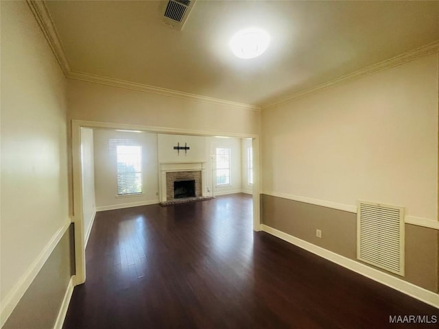 1604 Salisbury Dr, Montgomery, AL 36117 - unfurnished living room with dark wood-style flooring, crown molding, and a fireplace