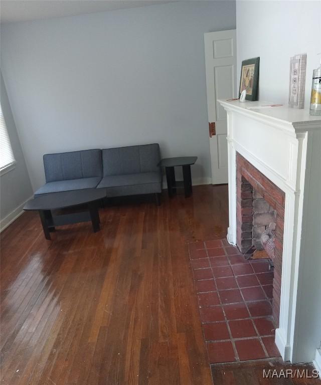 304 Patterson St, Tuskegee, AL 36088 - sitting room featuring hardwood / wood-style floors and a fireplace