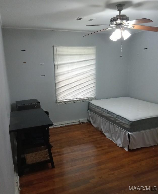 304 Patterson St, Tuskegee, AL 36088 - bedroom with wood finished floors and ceiling fan