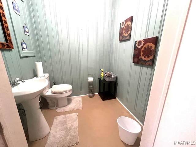 3628 Bankhead Ave, Montgomery, AL 36111 - half bathroom featuring toilet and wooden walls