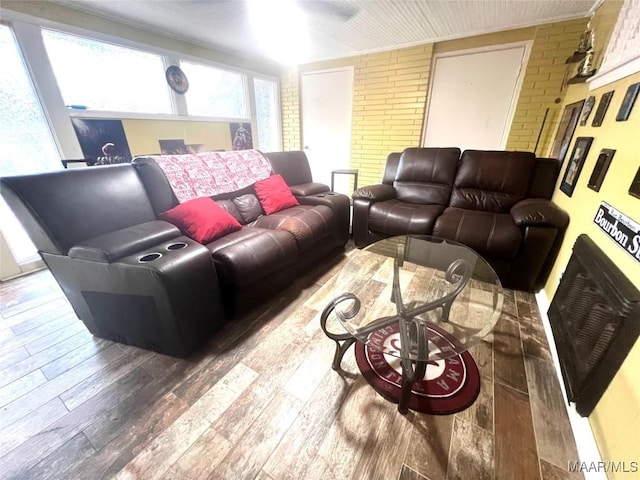 3628 Bankhead Ave, Montgomery, AL 36111 - living area featuring brick wall and wood-type flooring