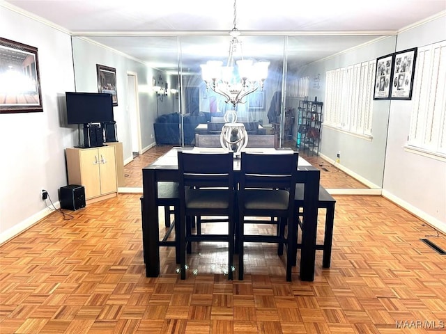 3628 Bankhead Ave, Montgomery, AL 36111 - dining area with crown molding and a chandelier