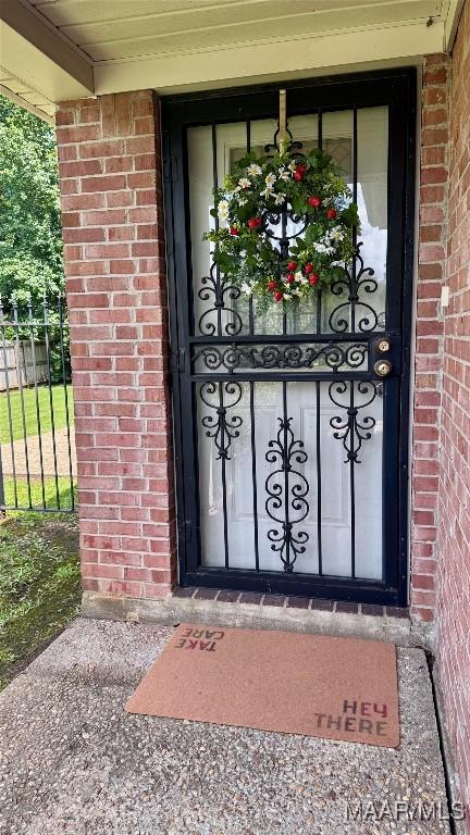 6537 Monmouth Mews, Montgomery, AL 36117 - doorway to property with brick siding