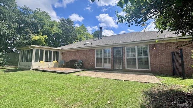 6537 Monmouth Mews, Montgomery, AL 36117 - back of house featuring brick siding, a sunroom, a yard, and a patio