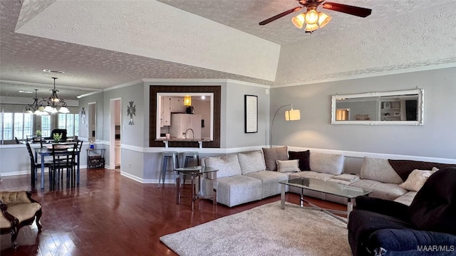 6537 Monmouth Mews, Montgomery, AL 36117 - living room featuring a textured ceiling, dark wood finished floors, a ceiling fan, ornamental molding, and a chandelier