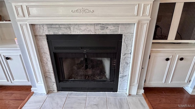6537 Monmouth Mews, Montgomery, AL 36117 - detailed view of a tiled fireplace and wood finished floors