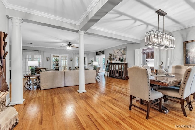 9021 Creek Side Trl, Hope Hull, AL 36043 - dining room with decorative columns, light wood-type flooring, a ceiling fan, ornamental molding, and a chandelier