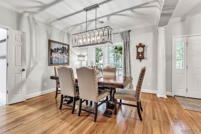 9021 Creek Side Trl, Hope Hull, AL 36043 - dining room with a chandelier, decorative columns, healthy amount of natural light, light wood-type flooring, and crown molding