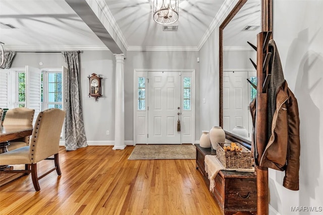 9021 Creek Side Trl, Hope Hull, AL 36043 - foyer entrance with light wood-type flooring, ornate columns, plenty of natural light, and ornamental molding