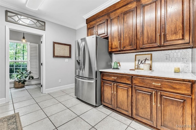 9021 Creek Side Trl, Hope Hull, AL 36043 - kitchen with stainless steel fridge, light tile patterned flooring, tasteful backsplash, light countertops, and crown molding