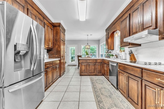 9021 Creek Side Trl, Hope Hull, AL 36043 - kitchen with appliances with stainless steel finishes, under cabinet range hood, ornamental molding, light tile patterned floors, and light countertops