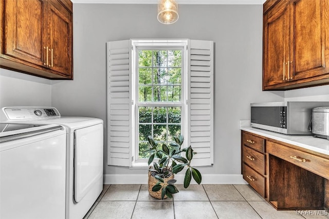 9021 Creek Side Trl, Hope Hull, AL 36043 - laundry room with independent washer and dryer, cabinet space, and light tile patterned floors