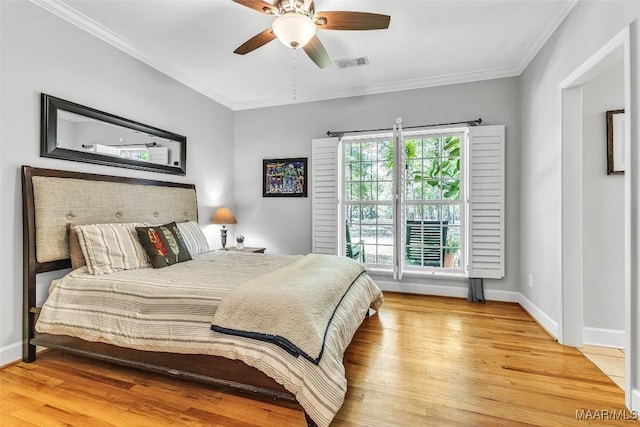 9021 Creek Side Trl, Hope Hull, AL 36043 - bedroom with wood finished floors, ornamental molding, and ceiling fan