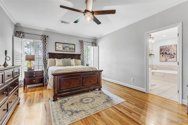 9021 Creek Side Trl, Hope Hull, AL 36043 - bedroom featuring multiple windows, light wood-type flooring, crown molding, and connected bathroom