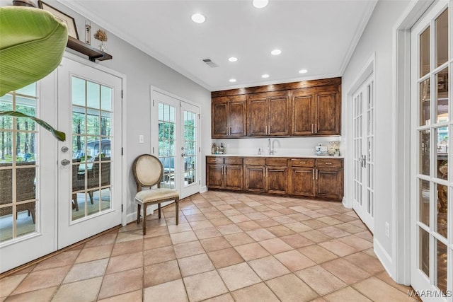 9021 Creek Side Trl, Hope Hull, AL 36043 - kitchen with french doors, crown molding, recessed lighting, light countertops, and dark brown cabinetry