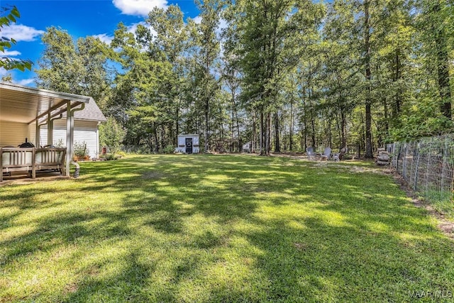 9021 Creek Side Trl, Hope Hull, AL 36043 - fenced backyard featuring a storage shed and a deck