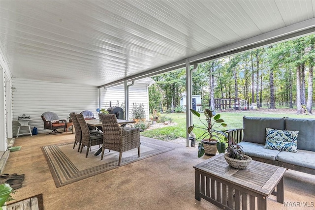 9021 Creek Side Trl, Hope Hull, AL 36043 - sunroom / solarium with outdoor dining area, an outdoor living space, and plenty of natural light