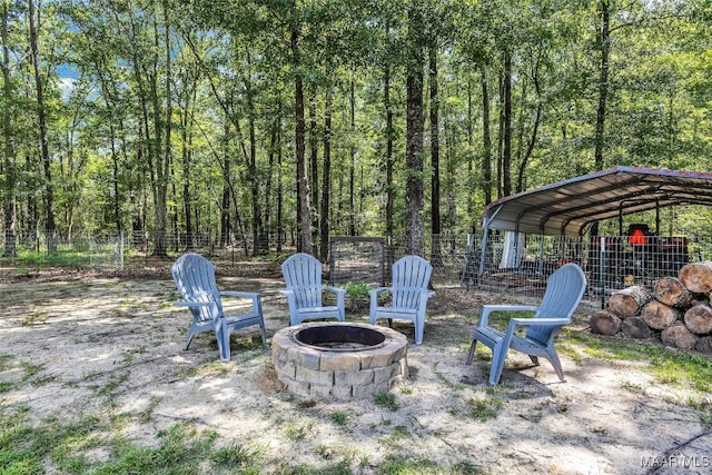 9021 Creek Side Trl, Hope Hull, AL 36043 - view of patio with a fire pit and a detached carport