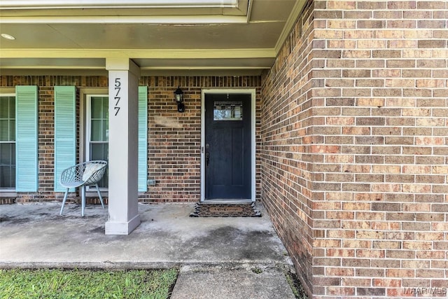 5777 Carriage Barn Ln, Montgomery, AL 36116 - property entrance with brick siding and a porch