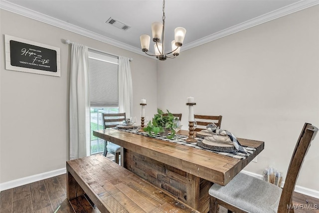 5777 Carriage Barn Ln, Montgomery, AL 36116 - dining area with a chandelier, crown molding, and wood finished floors