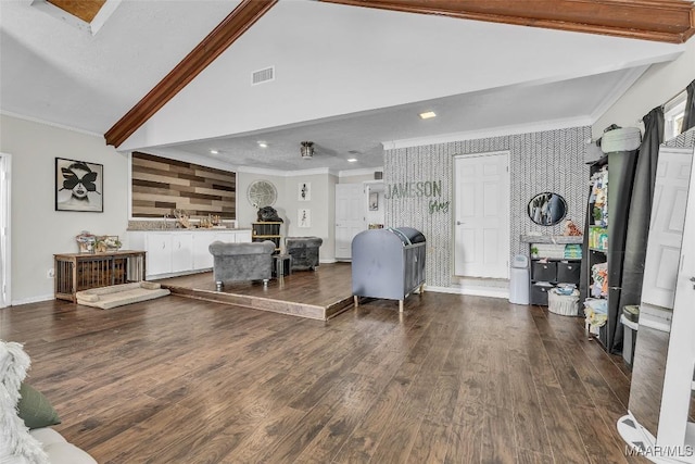 5777 Carriage Barn Ln, Montgomery, AL 36116 - living area featuring wallpapered walls, ornamental molding, dark wood-style flooring, an accent wall, and beamed ceiling