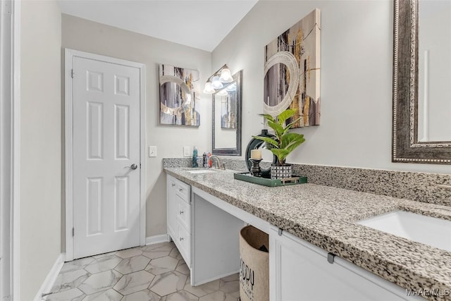 5777 Carriage Barn Ln, Montgomery, AL 36116 - bathroom with double vanity and baseboards