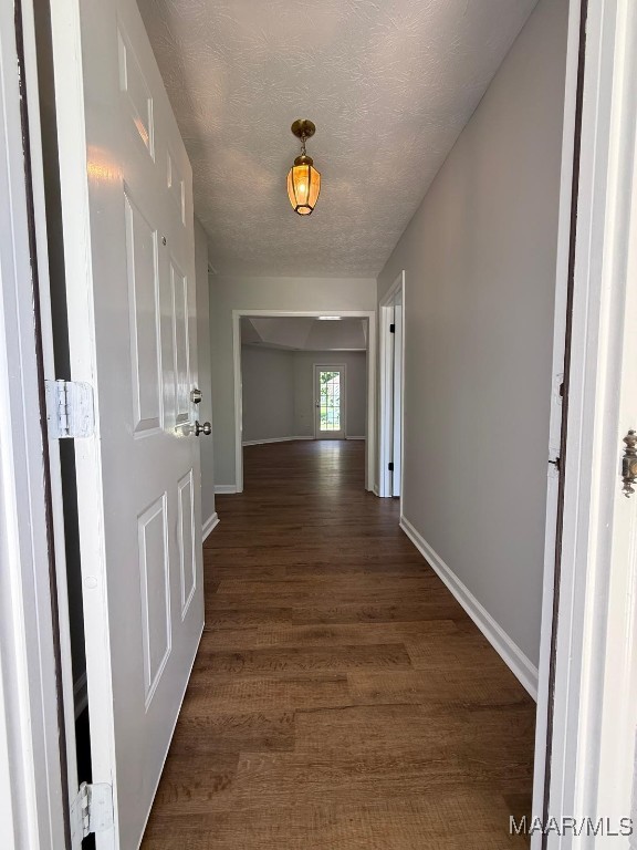 6524 Foxleigh Ct, Montgomery, AL 36116 - hall featuring dark wood-style floors and a textured ceiling
