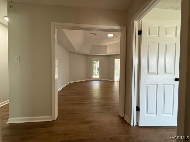 6524 Foxleigh Ct, Montgomery, AL 36116 - corridor featuring a tray ceiling and dark wood-style floors