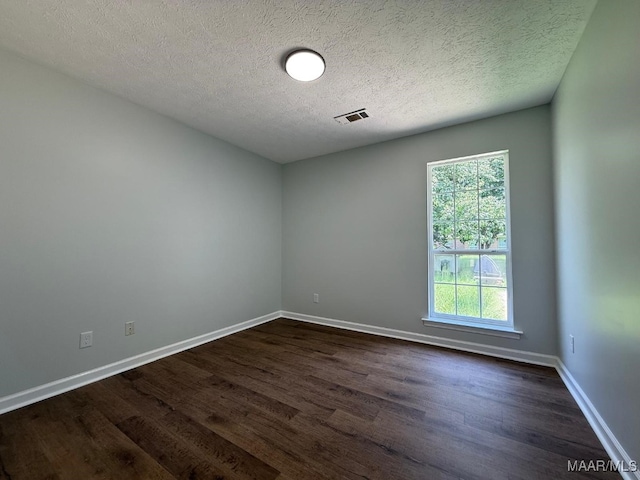 6524 Foxleigh Ct, Montgomery, AL 36116 - spare room featuring dark wood-type flooring and a textured ceiling