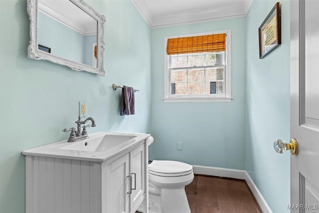 1613 Croom Dr, Montgomery, AL 36106 - half bathroom featuring crown molding, vanity, and wood finished floors