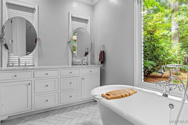 1613 Croom Dr, Montgomery, AL 36106 - bathroom featuring vanity, a soaking tub, and ornamental molding