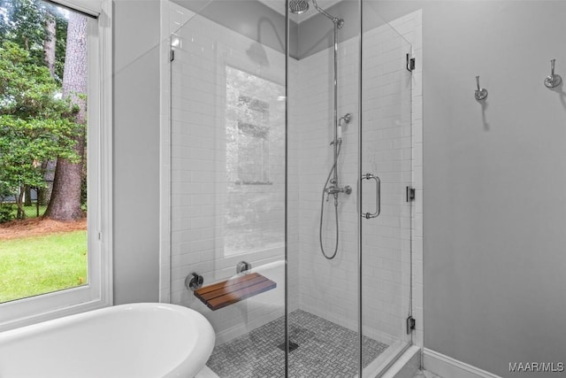1613 Croom Dr, Montgomery, AL 36106 - bathroom featuring a freestanding tub, a shower stall, and plenty of natural light