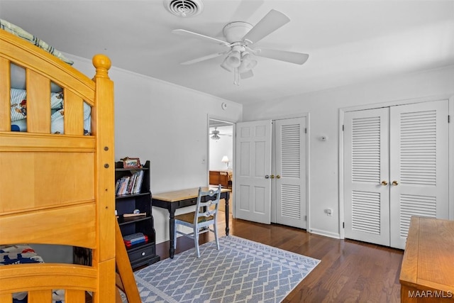 1613 Croom Dr, Montgomery, AL 36106 - bedroom with multiple closets, wood finished floors, and a ceiling fan