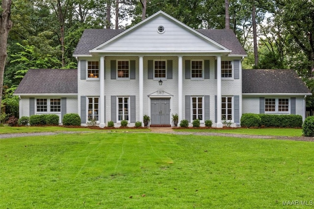 1613 Croom Dr, Montgomery, AL 36106 - greek revival inspired property with a front lawn, a shingled roof, brick siding, and covered porch