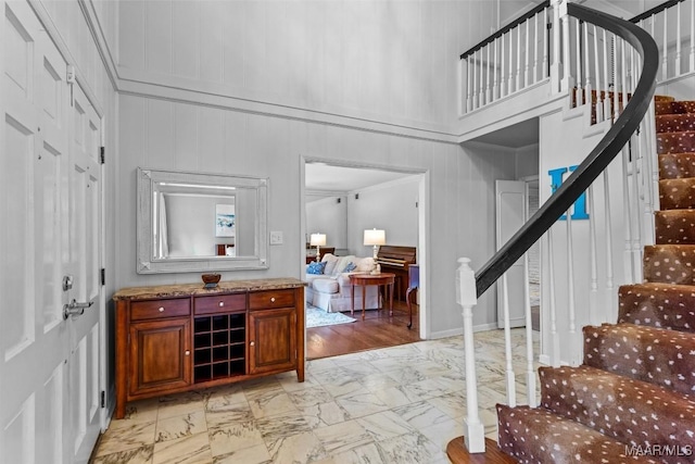 1613 Croom Dr, Montgomery, AL 36106 - entrance foyer featuring light marble finish floors, stairs, and a decorative wall