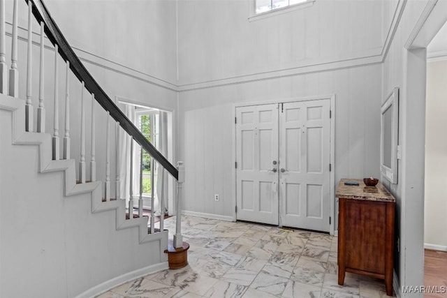 1613 Croom Dr, Montgomery, AL 36106 - entrance foyer featuring light marble finish flooring, stairs, and a high ceiling