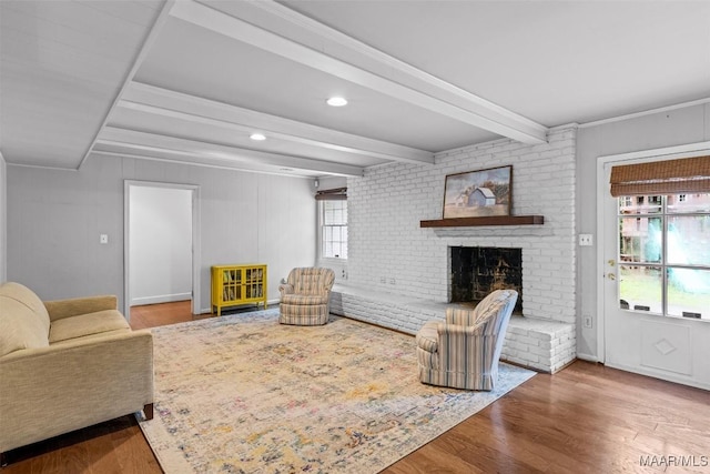 1613 Croom Dr, Montgomery, AL 36106 - living area with wood finished floors, a brick fireplace, beamed ceiling, and recessed lighting
