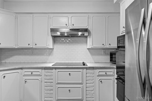 1613 Croom Dr, Montgomery, AL 36106 - kitchen with black appliances, under cabinet range hood, backsplash, and white cabinetry