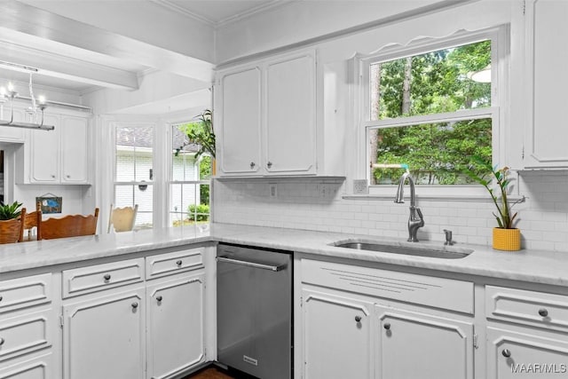 1613 Croom Dr, Montgomery, AL 36106 - kitchen with crown molding, white cabinetry, backsplash, and dishwasher
