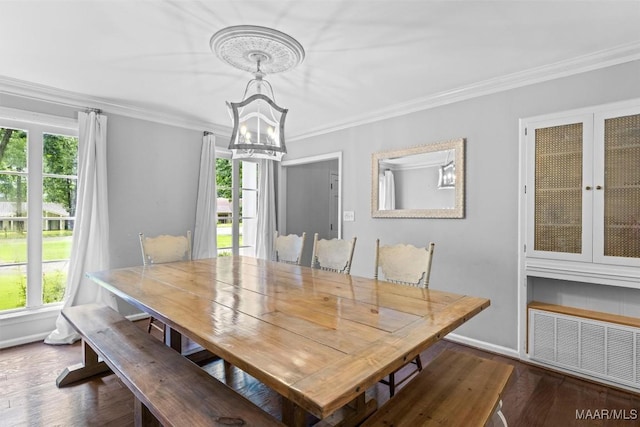 1613 Croom Dr, Montgomery, AL 36106 - dining room with a chandelier, healthy amount of natural light, crown molding, and dark wood-style floors