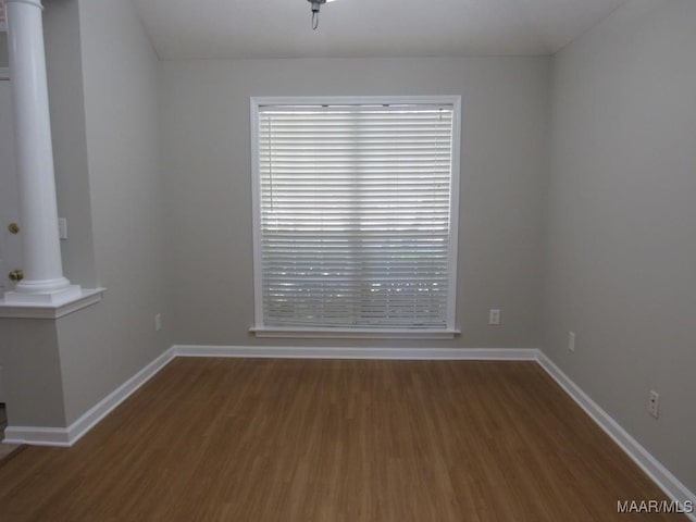 9467 Greythorne Way, Montgomery, AL 36117 - empty room featuring ornate columns, wood finished floors, and plenty of natural light