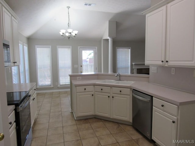 9467 Greythorne Way, Montgomery, AL 36117 - kitchen featuring stainless steel appliances, light tile patterned flooring, white cabinets, a peninsula, and vaulted ceiling