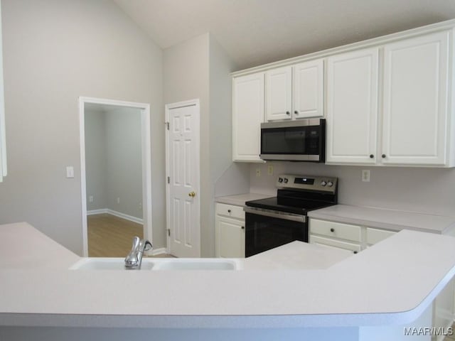 9467 Greythorne Way, Montgomery, AL 36117 - kitchen with stainless steel appliances, white cabinets, light countertops, and lofted ceiling