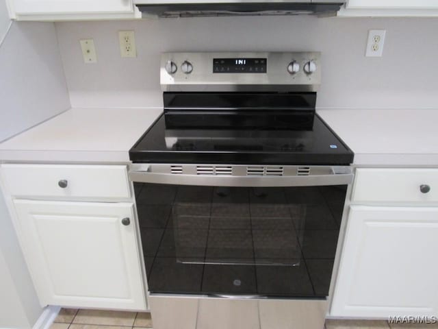 9467 Greythorne Way, Montgomery, AL 36117 - kitchen view of electric stove, light countertops, and white cabinetry