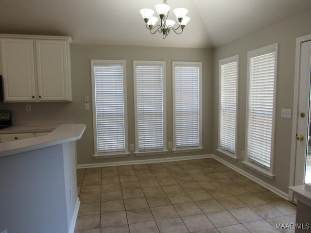 9467 Greythorne Way, Montgomery, AL 36117 - dining space with a chandelier, light tile patterned flooring, and lofted ceiling