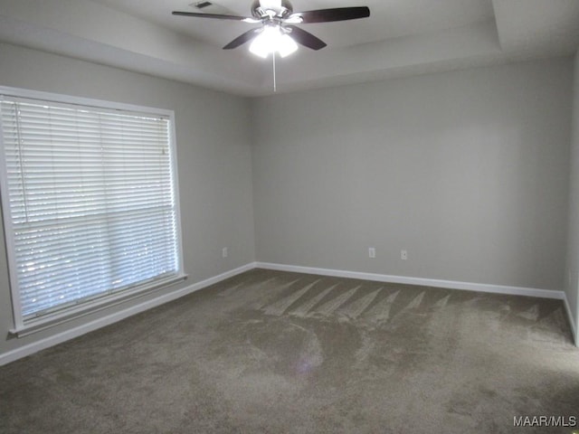 9467 Greythorne Way, Montgomery, AL 36117 - empty room featuring a tray ceiling, carpet flooring, and ceiling fan