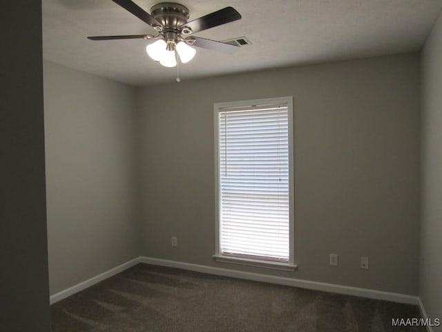 9467 Greythorne Way, Montgomery, AL 36117 - empty room featuring dark colored carpet, ceiling fan, and plenty of natural light