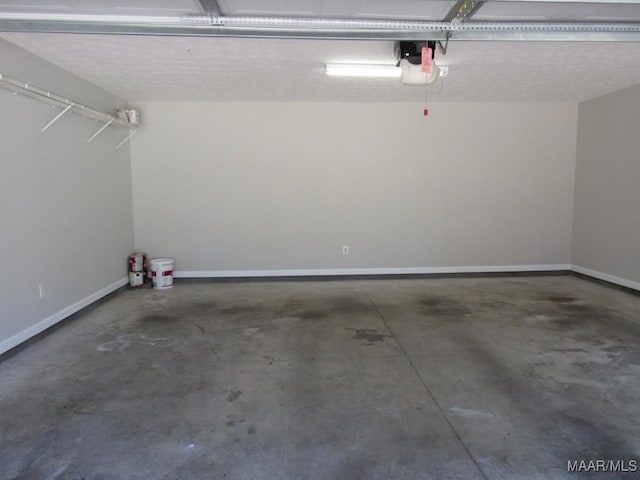 9467 Greythorne Way, Montgomery, AL 36117 - garage featuring a garage door opener and baseboards